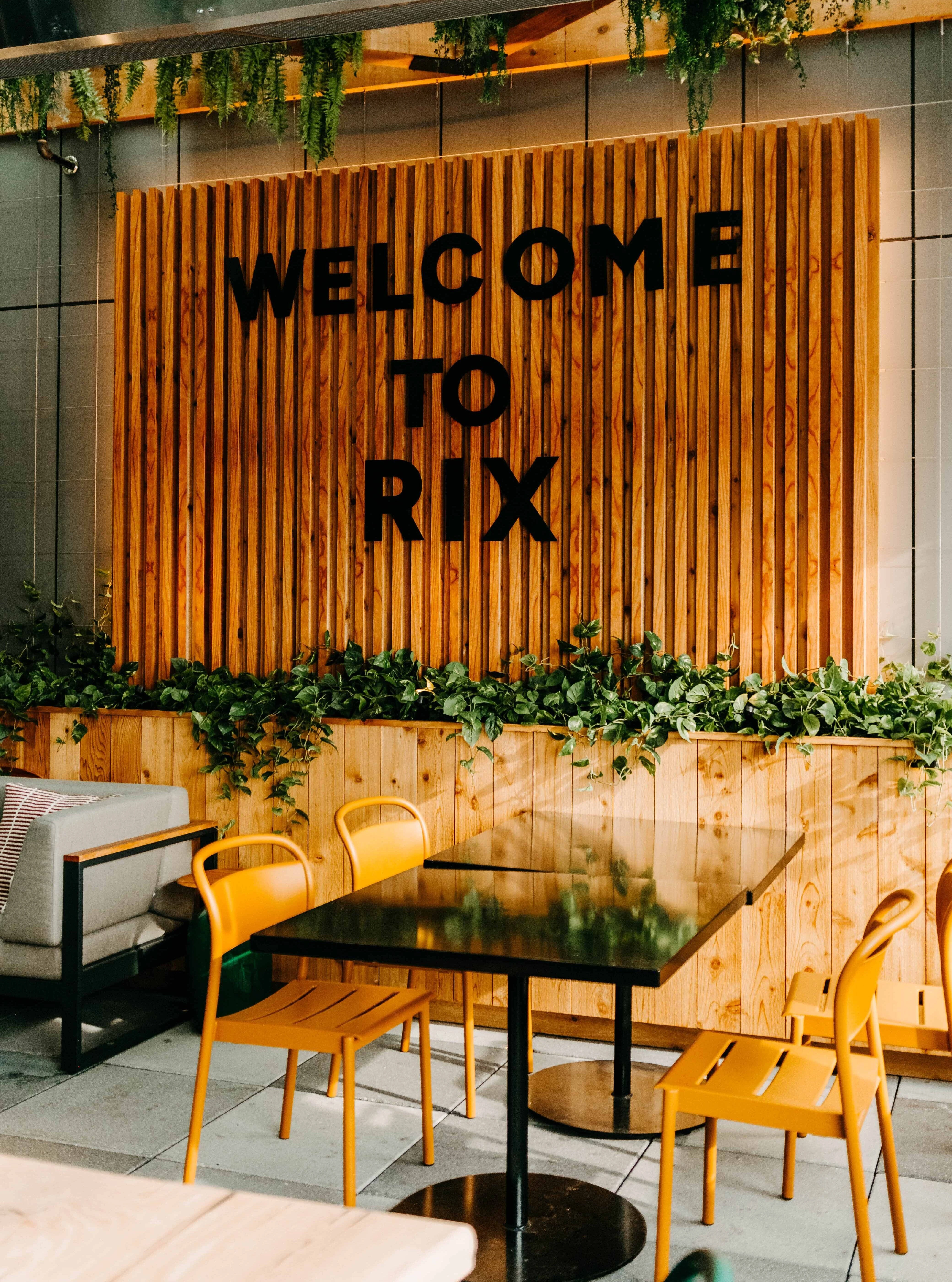 Outdoor Terrace at Rix with lettering on wall reading 'Welcome to Rix'